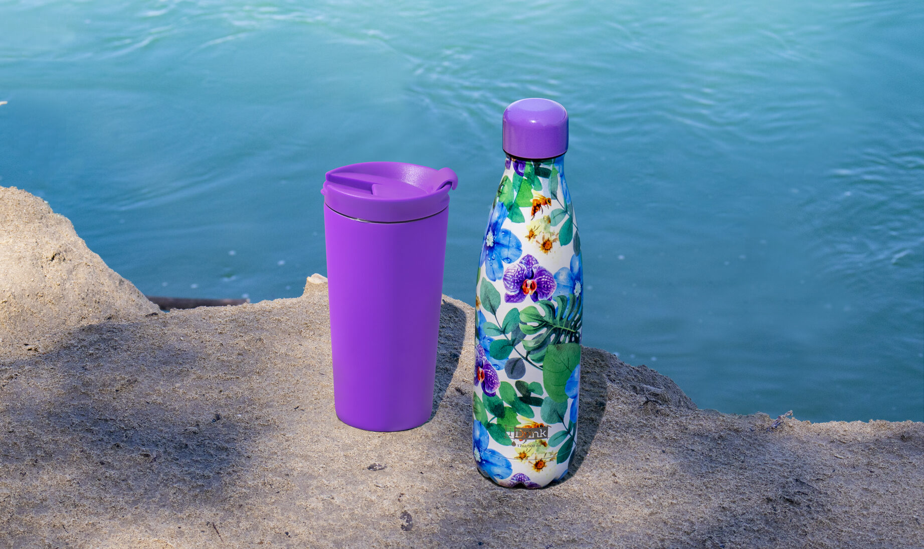 Stainless Steel Water Bottle with outer plastic shell and bottom that  unscrews
